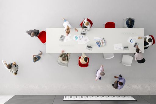 Business Meeting taking Place at Desk