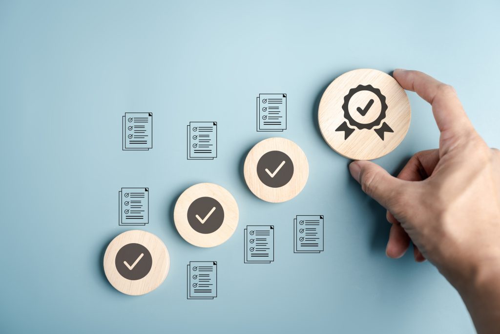 Blue wall with paper forms icons and round wooden disk with checkmarks