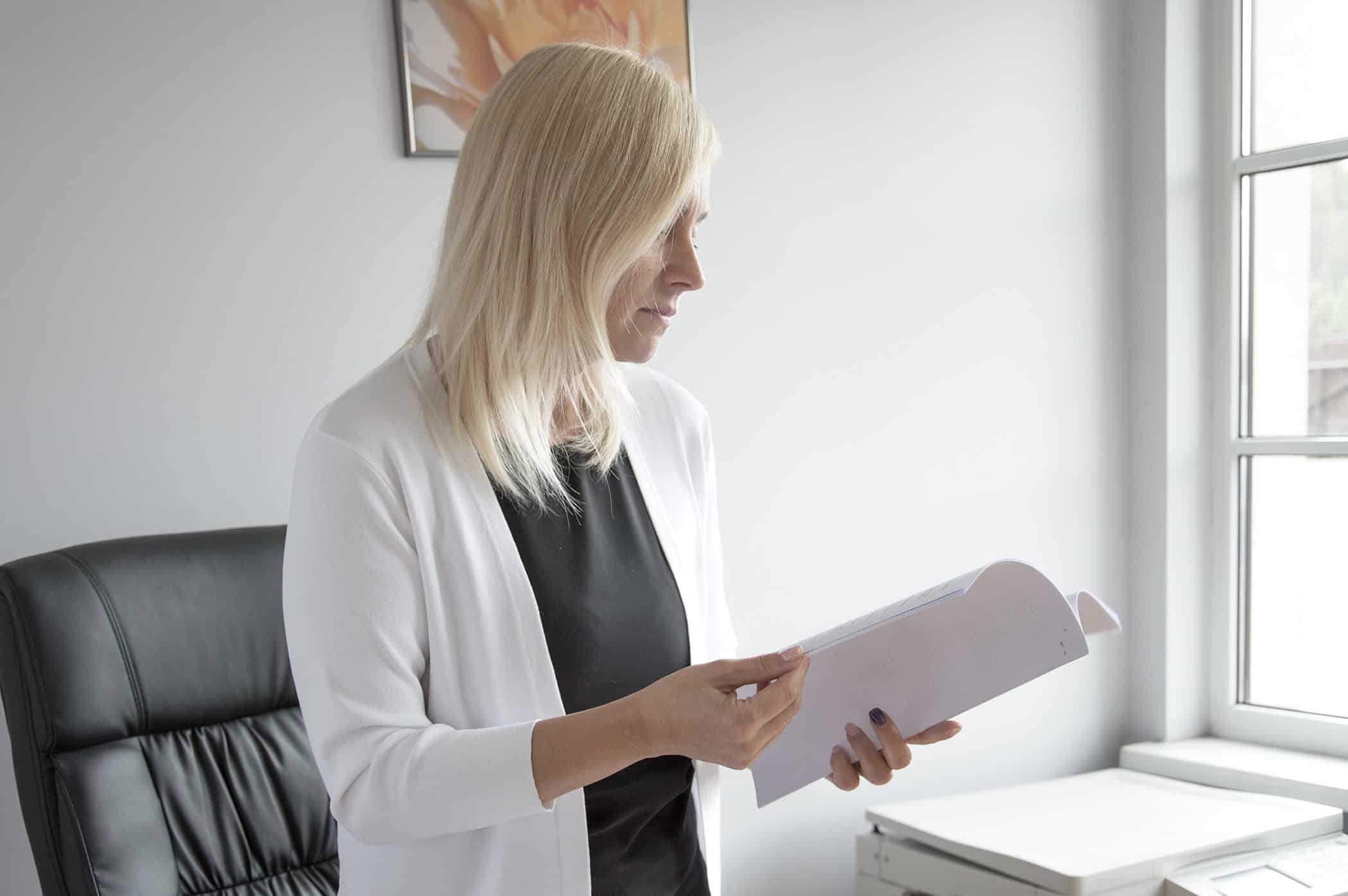 woman holding a paper