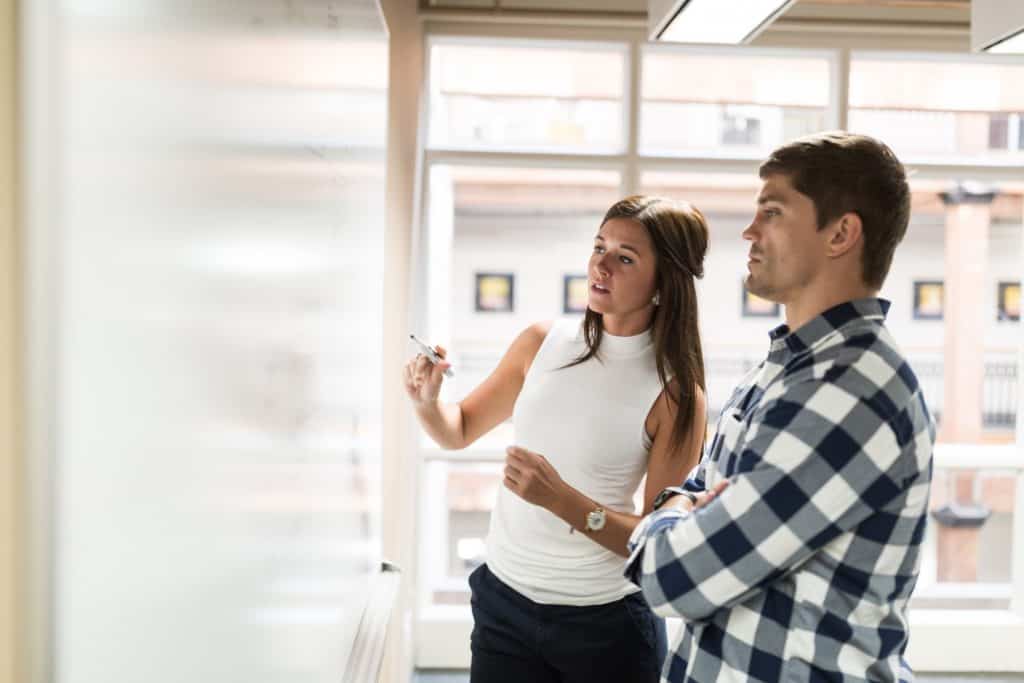 young professionals at whiteboard