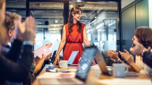 Business woman presenting to a team meeting
